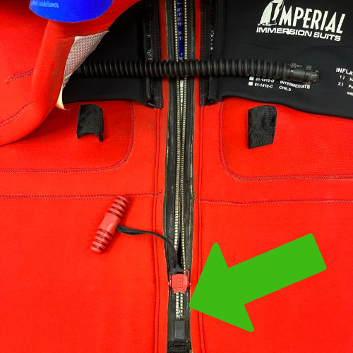 Survival suit zipper one inch up from bottom of track